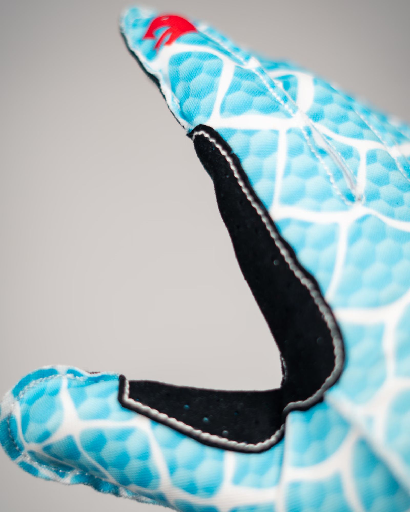 Close-up of the padded webbing between thumb and index finger on the V2 Ice Serpent.
